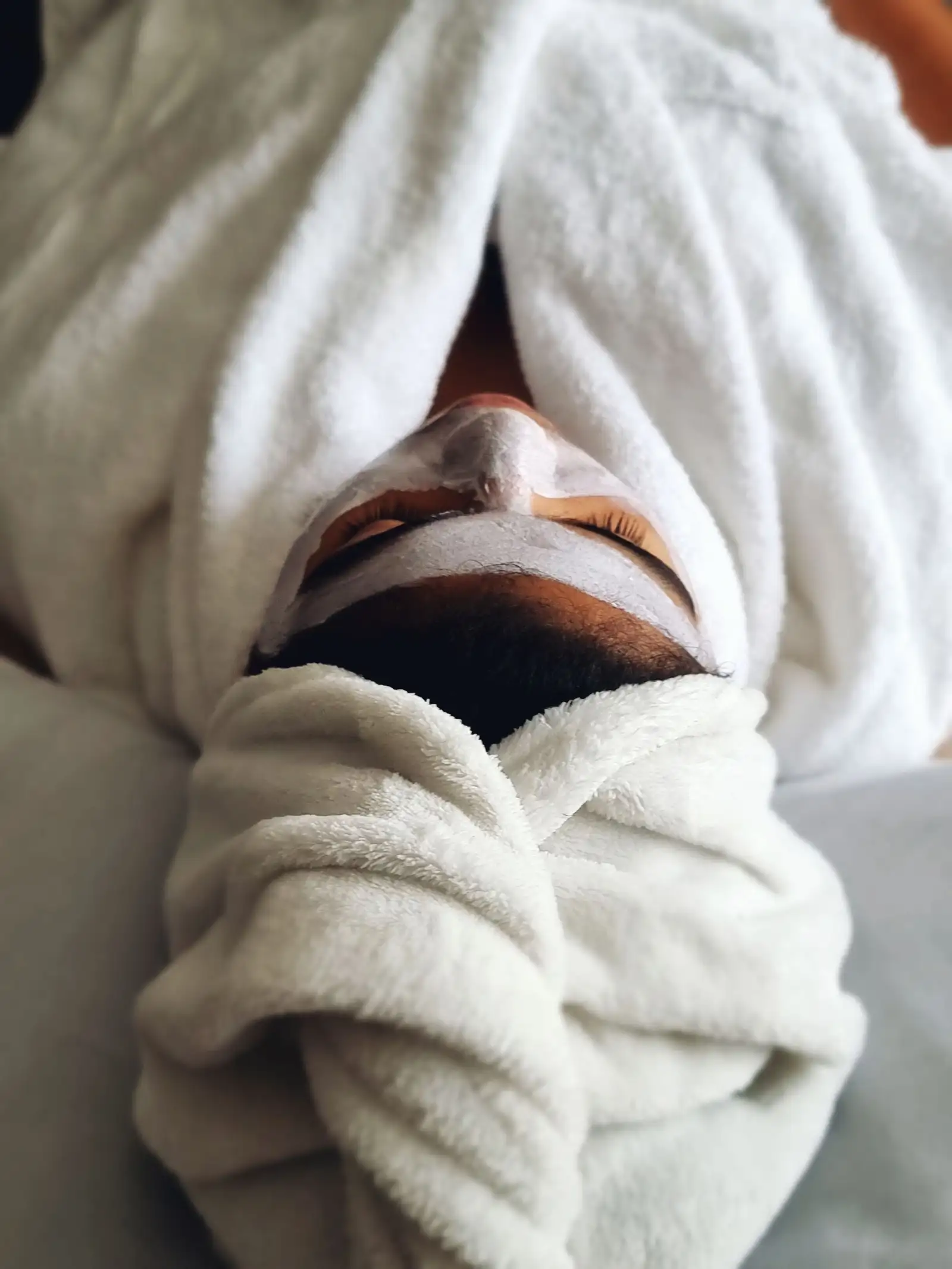 A client relaxing during a spa treatment