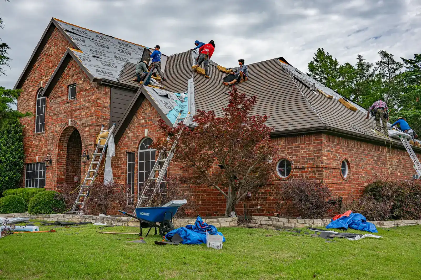 Ridgeline crew replacing the roof on a brick home